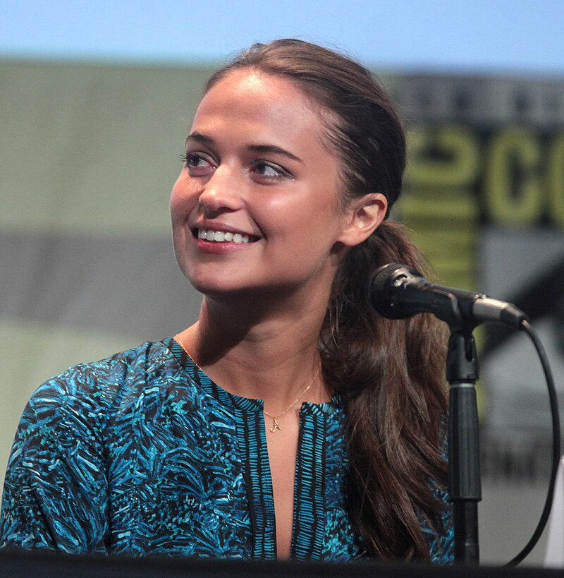Vikander achieved global recognition for her roles as Vera Brittain in Testament of Youth (2014), a humanoid robot in Ex Machina (2014), for which she was nominated for the BAFTA Award for Best Actress in a Supporting Role, and Gerda Wegener in The Danish Girl (2015), for which she won the Academy Award for Best Supporting Actress. In 2016, Vikander was listed by Forbes in its 30 Under 30 list. She has since starred in the action film Jason Bourne (2016), the adventure film Tomb Raider (2018), the fantasy film The Green Knight (2021), and the miniseries Irma Vep (2022).