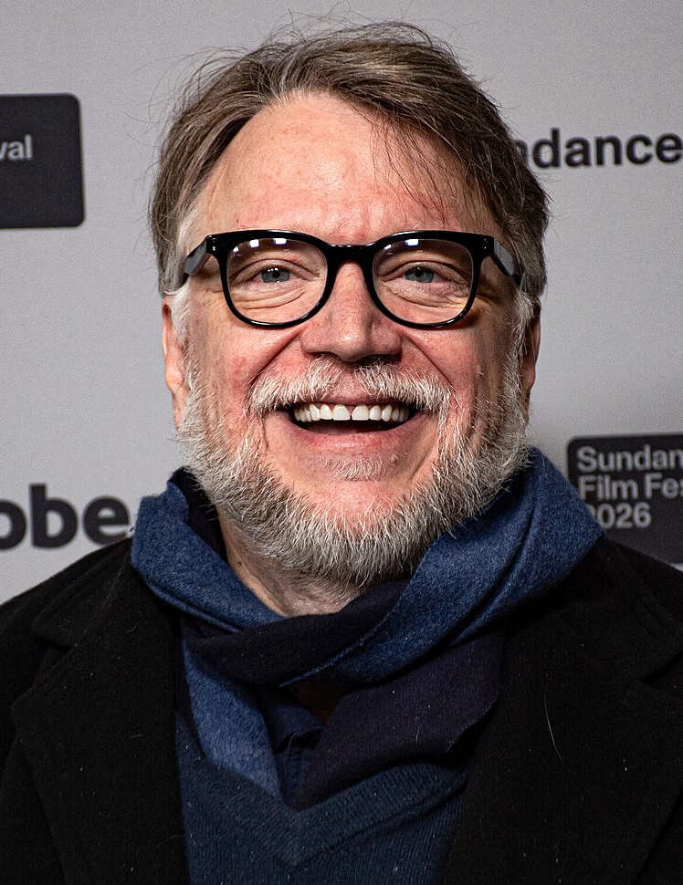 Guillermo del Toro Gómez (born 9 October 1964) is a Mexican filmmaker, author, and artist. His work has been characterized by a strong connection to fairy tales, gothicism, and horror, often blending the genres, with an effort to infuse visual or poetic beauty in the grotesque. He has had a lifelong fascination with monsters, which he considers symbols of great power. del Toro is known for pioneering dark fantasy in the film industry and for his use of insectile and religious imagery, his themes of Catholicism, celebrating imperfection, underworld motifs, practical special effects, and dominant amber lighting.